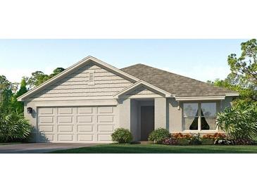 Charming single-story home with a two-car garage and well-manicured lawn at 12112 Kingsley Trl, Parrish, FL 34219