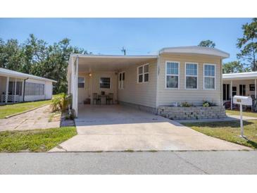Inviting exterior with covered parking and well-maintained landscaping in a friendly neighborhood at 1307 41St E Ave, Ellenton, FL 34222