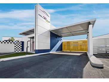 Commercial building exterior with a covered entrance, sleek design, and ample parking space at 8100 Ciboney Ct # 11, Sarasota, FL 34240