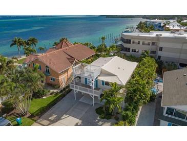 Stunning waterfront home with a rooftop deck offering panoramic ocean views at 113 8Th S St, Bradenton Beach, FL 34217