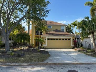 Charming two-story home with a well-maintained lawn and a large, two car garage at 11516 Sweetflag Dr, Lakewood Ranch, FL 34202