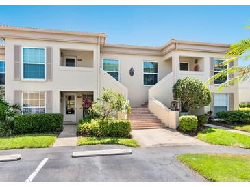 Inviting two-story condo with well-maintained landscaping and convenient parking at 4355 Longmeadow # 23, Sarasota, FL 34235