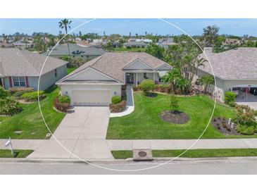 Well-maintained single-Gathering home features manicured lawn, lovely landscaping, and a two-car garage at 8643 46Th Avenue W Cir, Bradenton, FL 34210