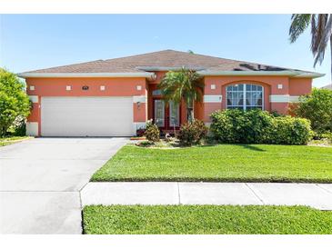 Charming single-story home with a well-manicured lawn, lush landscaping and a two car garage at 4918 Avon Ln, Sarasota, FL 34238