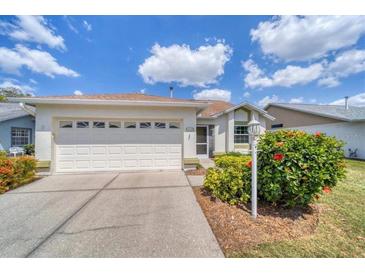Charming one-story home featuring a two-car garage and well-maintained landscaping at 3449 Yonge Ave, Sarasota, FL 34235