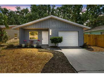 Charming single-story home with a freshly painted exterior and a well-maintained front yard, perfect for curb appeal at 4741 Watkins Ave, Sarasota, FL 34233