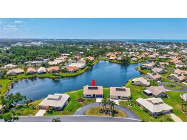 Beautiful aerial view of a waterfront home with lush landscaping and gorgeous curb appeal in a desirable neighborhood at 75 Inlets Blvd # 75, Nokomis, FL 34275