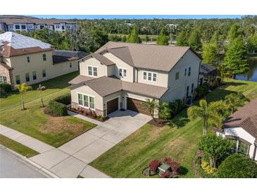 Two-story home with well-kept lawn, two car garage and screened in porch overlooking a pond at 13116 Bliss Loop, Bradenton, FL 34211