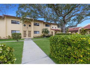 Inviting exterior with lush landscaping and a charming walkway leading to the entrance of the home at 5625 15Th Ave W, Bradenton, FL 34209
