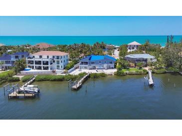 Waterfront homes with private docks boasting direct Gulf access and stunning ocean views at 7985 Manasota Key Rd, Englewood, FL 34223