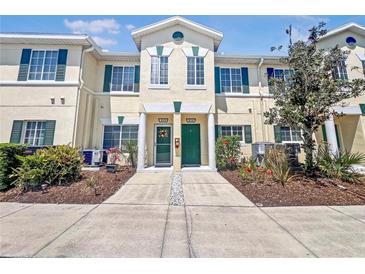 Charming townhome featuring green shutters and landscaping at 238 Cape Harbour Loop # 104, Bradenton, FL 34212
