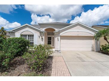Charming single-story home with well-maintained landscaping and attached two-car garage at 4610 Runabout Way, Bradenton, FL 34203
