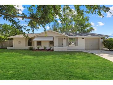 Charming single-story home with a well-manicured lawn and a quaint, inviting facade at 3301 62Nd Street W Cir, Bradenton, FL 34209