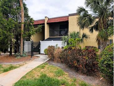 Inviting two-story condo with lush landscaping and a charming private balcony at 105 S Obrien St # 213, Tampa, FL 33609