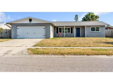 Inviting single-Gathering home featuring a neatly maintained front yard and attached garage at 2705 20Th Avenue W Dr, Bradenton, FL 34205