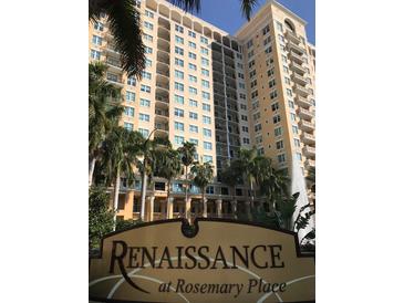 Renaissance at Rosemary Place building exterior featuring lush landscaping and a water fountain at 750 N Tamiami Trl # 208, Sarasota, FL 34236