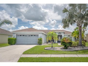 Charming single-story home with a well-manicured lawn and lovely curb appeal at 12026 Warwick Cir, Parrish, FL 34219