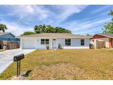 Charming single-story home with an attached garage, well-maintained lawn, and inviting curb appeal at 6611 2Nd Ne Ave, Bradenton, FL 34208
