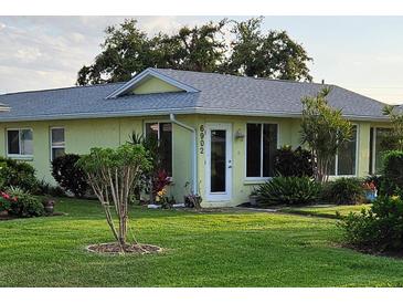 Charming single-story home with a well-manicured lawn and inviting front entrance at 6902 11Th W Ave, Bradenton, FL 34209