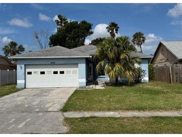 Charming single-story home with well-maintained lawn and a two car garage at 6928 43Rd E Ct, Sarasota, FL 34243