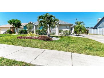 Charming single-story home features a well-manicured lawn and decorative bicycle at 1008 83Rd Nw St, Bradenton, FL 34209