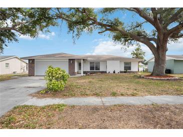 Charming single Gathering home with a large, shady tree in the front yard at 1007 Southern Pine Ln, Sarasota, FL 34243