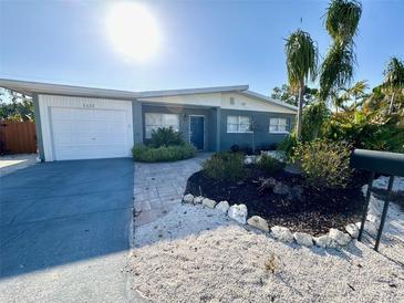 Charming single-story home with landscaped front yard and a driveway leading to a one-car garage at 1112 65Th Nw St, Bradenton, FL 34209
