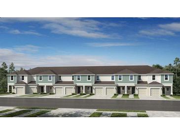 Charming townhome showcasing a welcoming facade and manicured landscaping at 15140 Cuzcorro Ct, Nokomis, FL 34275