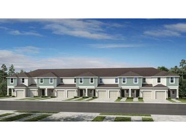 Charming townhome with a two-car garage, beautiful landscaping, and a well-maintained exterior at 15149 Cuzcorro Ct, Nokomis, FL 34275