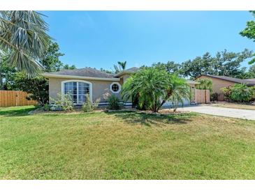 Charming single-story home with well-manicured lawn and lush landscaping at 2303 58Th E St, Palmetto, FL 34221