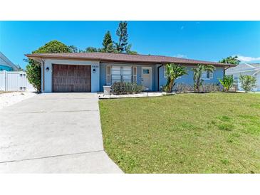 Charming single-story home featuring a well-manicured lawn and an attached garage at 8420 43Rd Avenue W Dr, Bradenton, FL 34209