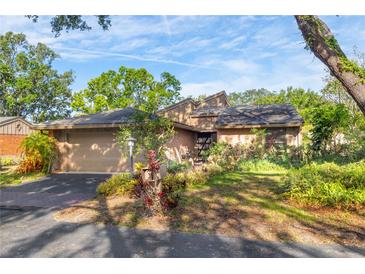 Charming single-story home with a well-maintained yard and attached two-car garage at 1502 Water Oak S Way, Bradenton, FL 34209