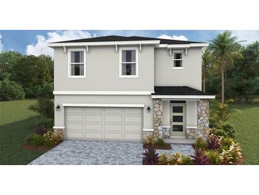 Two-story home featuring a two-car garage and stone accents on the front entrance at 1840 Cobb Trl, Parrish, FL 34219