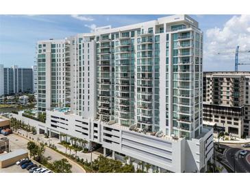 Stunning high-rise condo building with modern architectural design and ample balconies at 301 Quay Commons # 1709, Sarasota, FL 34236