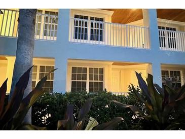 Inviting exterior view featuring a balcony and lush greenery surrounding the building at 3506 54Th W Dr # 103, Bradenton, FL 34210