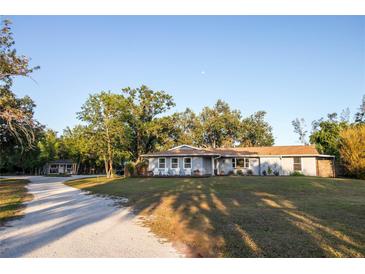 Charming single story home with mature trees and inviting front porch at 3717 Downer Ave, Sarasota, FL 34240