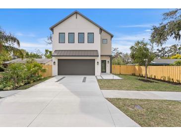 Stunning two-story home showcasing modern architecture and a well-manicured front yard at 2249 Oak Terrace St, Sarasota, FL 34231