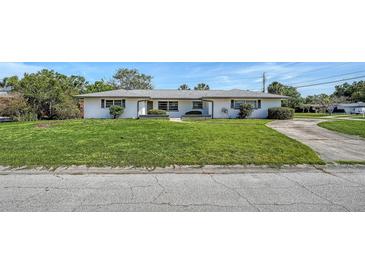Charming single-story home with a well-maintained lawn and classic curb appeal at 2702 Bedford Way, Sarasota, FL 34239