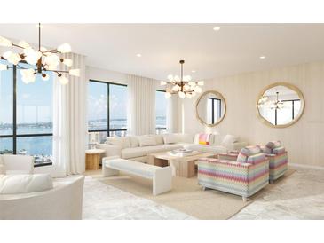 Bright living room featuring floor-to-ceiling windows with ocean views and stylish modern decor at 33 S Palm Ave # 1501, Sarasota, FL 34236