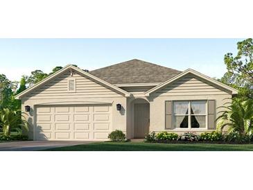 Charming one-story home featuring an attached two-car garage and meticulously landscaped front yard at 4513 Dusky Dawn Ln, Palmetto, FL 34221