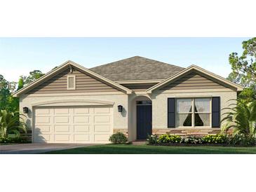 Charming one-story home featuring beige siding, a two-car garage, and a well-manicured front lawn at 18219 Wheathouse Pl, Lakewood Ranch, FL 34211