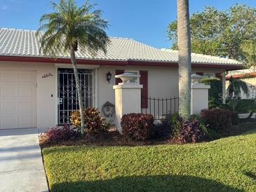 Charming single-story home with a well-maintained front yard and security door at 6615 12Th Ave W W Ave, Bradenton, FL 34209