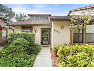 Charming home exterior with well-maintained landscaping, clear house numbers, and welcoming front entrance at 7907 4Th W Ave # 7907, Bradenton, FL 34209