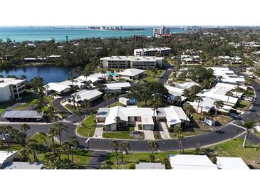 Desirable community offering villas, condos, pool and water views in a lush landscape near beaches and downtown at 111 Whispering Sands Cir # V38, Sarasota, FL 34242
