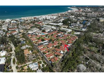 Incredible aerial view of a residential community with stunning ocean views and easy access to the beach at 151 Vista Hermosa Cir # 31C, Sarasota, FL 34242