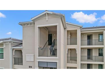 A close exterior view of an upscale condo featuring private entry staircases at 18114 Gawthrop Dr # 402, Bradenton, FL 34211