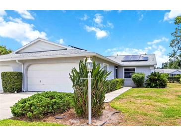Charming single-story home with well-maintained landscaping and solar panels for energy efficiency at 3662 Bonaventure Ct, Sarasota, FL 34243