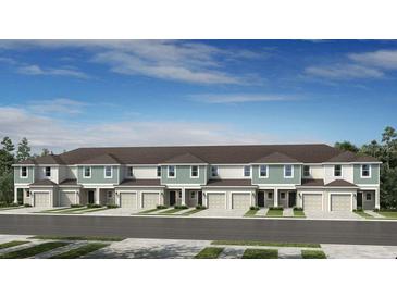 Beautiful townhome featuring a private garage and landscaped front yard at 15164 Cuzcorro Ct, Nokomis, FL 34275