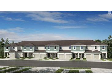 Attractive new townhomes with attached garages and manicured landscaping create excellent curb appeal at 15176 Cuzcorro Ct, Nokomis, FL 34275