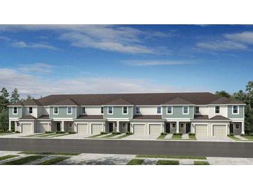 Charming townhome showcases an attractive facade and well-manicured landscaping, set against a serene blue sky at 15188 Cuzcorro Ct, Nokomis, FL 34275
